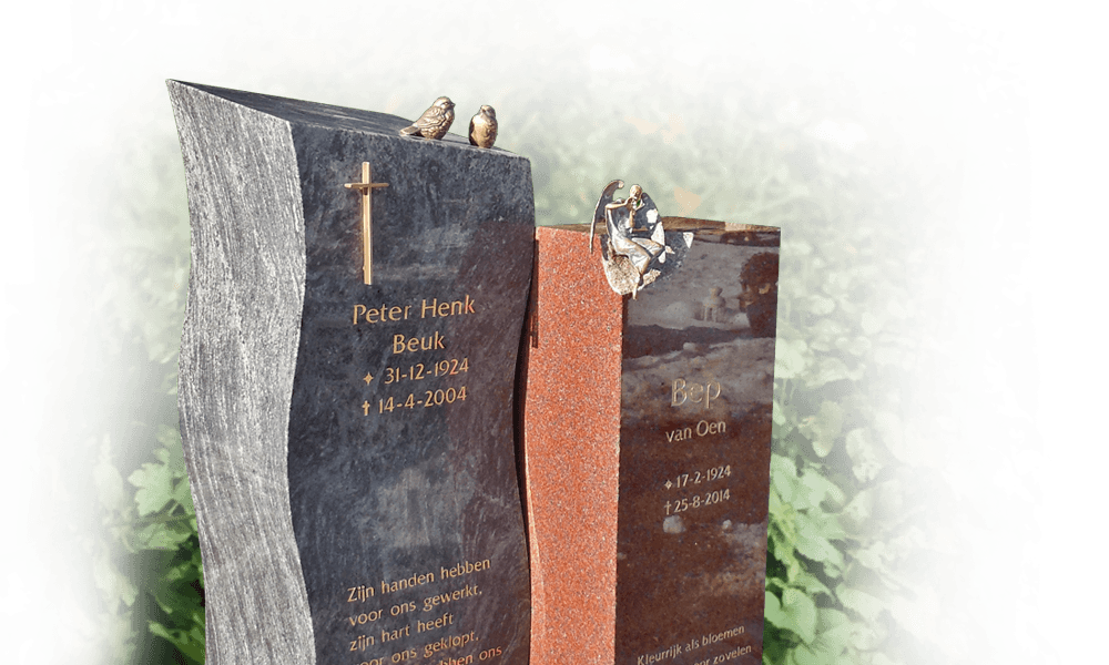 gedenkbeelden en symbolen grafsteen met engel en kruis