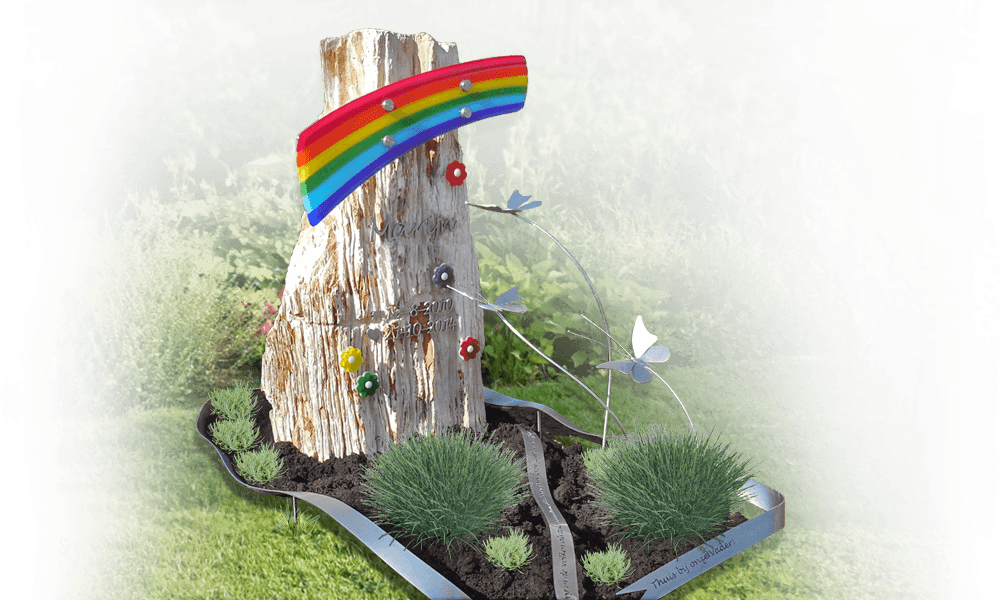 kindergraf monument symbolen betekenis kleurige decoraties regenboog bloemetjes