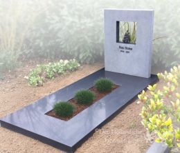 Grafmonument met bronzen kunstwerkje