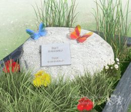 Kindermonument met zwerfkei en glazen vlinders