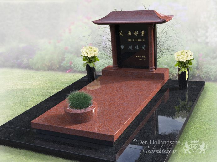 Chinees grafmonument met bloemen en plantenbak foto 1