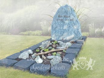 Grafmonument met blauw ruw natuursteen