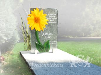 Grafmonument van glas met een zonnebloem