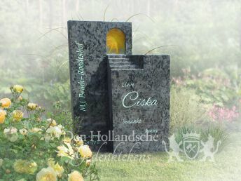 Grafmonument van natuursteen met glas