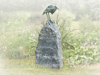 Zwerfkei met bronzen reiger